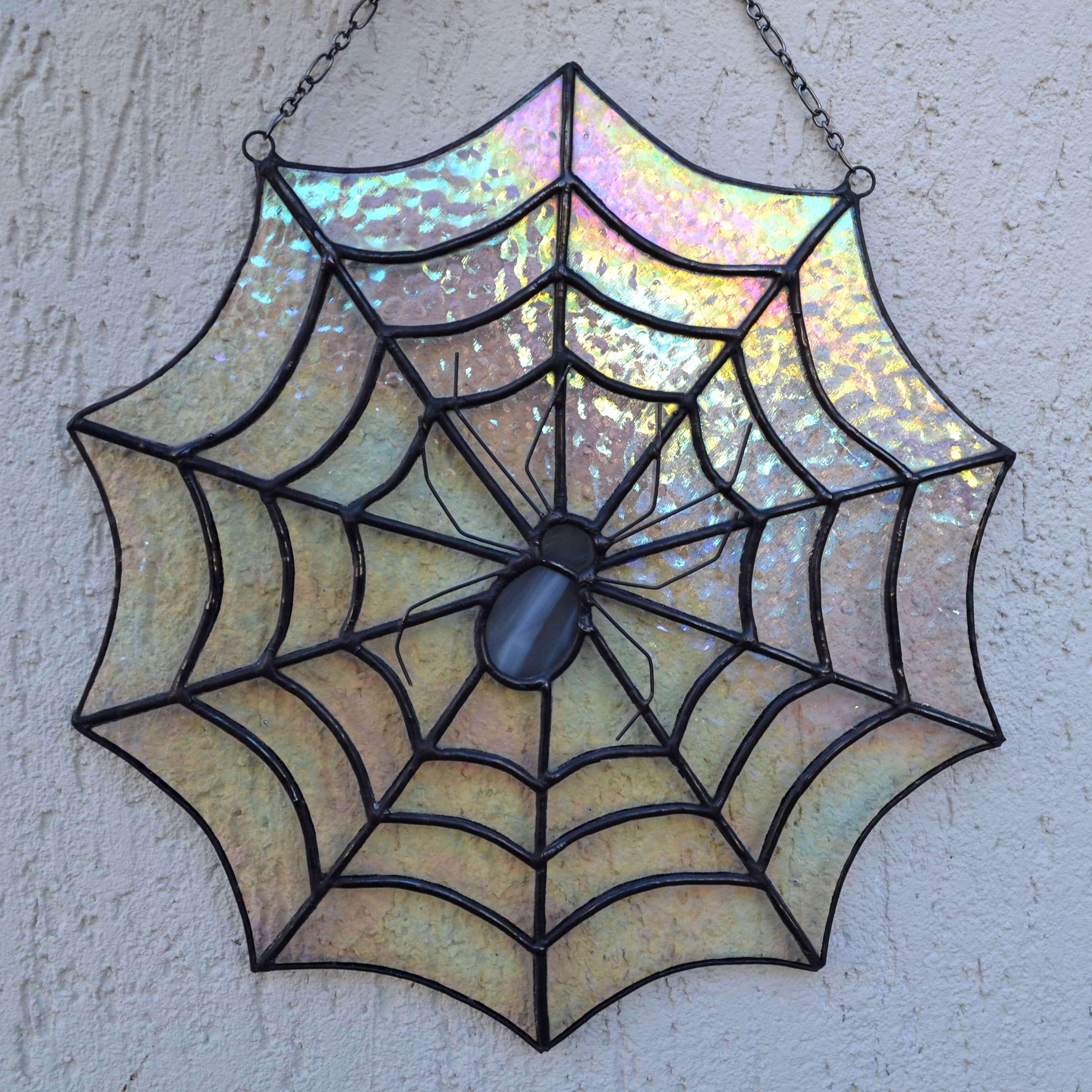 Stained glass half web deals with spider